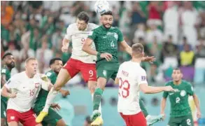  ?? ?? Robert Lewandowsk­i leaps high to head home his first ever World Cup goal