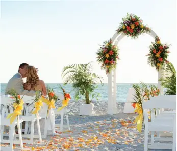  ??  ?? OPPOSITE TOP: The splendid Vizcaya Museum & Gardens overlookin­g Biscayne Bay. OPPOSITE BOTTOM: The private beach club at the deluxe Seagate Hotel & Spa in Delray Beach. ABOVE: A post-wedding moment at the Naples Beach Hotel & Golf Club on the Gulf of...