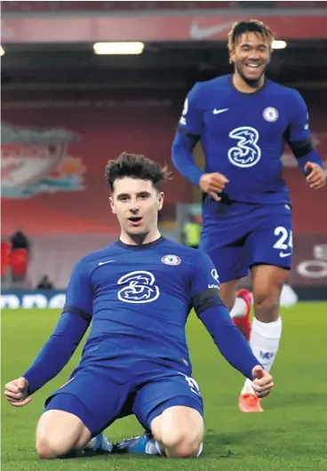  ??  ?? On the slide:
Mason Mount celebrates the goal that made it five home defeats in a row for Liverpool