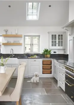  ??  ?? A trio of wicker baskets helps break up the uniformity of fitted cabinetry, bringing texture and character to the mix.