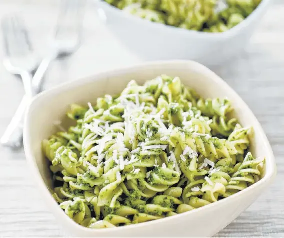  ??  ?? Fusilli pasta with a pesto of kale and sunflower seeds was created in America’s Test Kitchen in Brookline, Mass. This recipe appears in the cookbook “Cooking at Home With Bridget and Julia.”