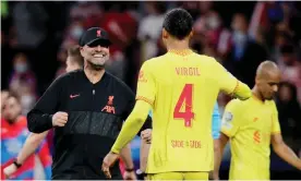  ?? Photograph: Soccrates Images/Getty Images ?? Jürgen Klopp celebrates victory over Atlético Madrid with Virgil van Dijk. The defender is yet to return to his peak form after a long injury lay-off.