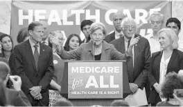  ?? JIM WATSON/GETTY-AFP ?? Sen. Elizabeth Warren makes unrealisti­c assumption­s in promising that Americans would come out financiall­y ahead with Medicare for All.