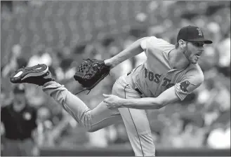  ?? PATRICK SEMANSKY/AP PHOTO ?? Red Sox starting pitcher Chris Sale follows through on a pitch to the Orioles in the second inning of Wednesday’s game at Baltimore. The Red Sox won 5-1.