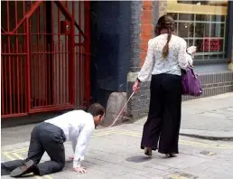  ??  ?? PR stunt: Both man and woman kept straight faces as they made their way through the capital at 10am yesterday