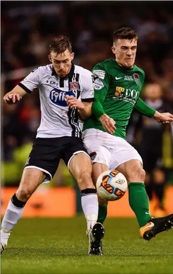  ??  ?? David McMillan of Dundalk is tackled by New Ross native Ryan Delaney of Cork City during the Irish Daily Mail FAI Senior Cup final at the Aviva Stadium.