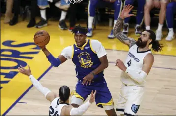  ?? KARL MONDON — BAY AREA NEWS GROUP ?? The Golden State Warriors’ Kevon Looney (5) scoops up one of his 22rebounds against the Memphis Grizzlies in Game 6 of a second-round playoff series at Chase Center in San Francisco on Friday.