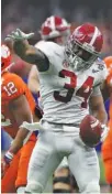  ?? PHOTO BY CRIMSON TIDE PHOTOS ?? Alabama running back Damien Harris makes the first-down signal after converting on fourthand-1 midway through the third quarter of Monday night’s 24-6 win over Clemson in the Sugar Bowl.
