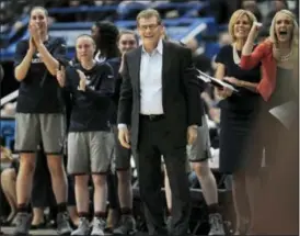  ?? THE ASSOCIATED PRESS ?? UConn head coach Geno Auriemma, center, and his team reacts in the first half against South Florida, Tuesday, Jan. 10, 2017, in Hartford, Conn.