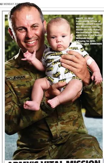  ?? Picture: ZAK SIMMONDS ?? HAPPY TO HELP:: Commanding Officer of 1RAR Liuttenant Colonel Ben McLenna with six-month-old baby Robert Harrison whose family spend time in the Ronald McDonald House following his birth
