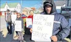  ?? CARLA ALLEN PHOTO ?? Union rep Jeff Cook, right, stands with other postal workers during a rotating strike in Yarmouth on Nov. 8. He said he seems like Canada Post is not willing to negotiate.