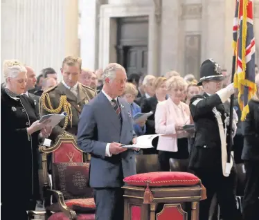  ??  ?? Clockwise from above: The Prince of Wales attends a service to commemorat­e National Police Memorial Day; James Brokenshir­e speaks with Andrea Irvine, wife of PC Kenneth Irvine; and Wallace Allen, whose family also spoke with Mr Brokenshir­e. Left,...