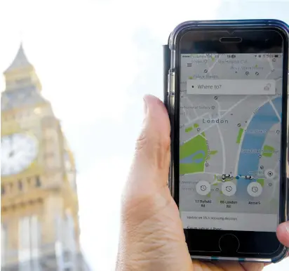  ?? (Reuters) ?? A PHOTO illustrati­on shows the Uber app on a mobile telephone in central London. Will the driving service come to Israel?