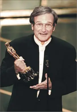  ?? Kirk McKoy Los Angeles Times ?? A NEW endowed chair in comedy at USC is named for Robin Williams, pictured accepting his supporting actor Academy Award for “Good Will Hunting” in 1998.