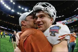  ?? SEAN GARDNER / GETTY IMAGES ?? Texas is set at quarterbac­k with Sam Ehlinger, who had a breakout season in 2018. He’s seen here with Longhorns coach Tom Herman.