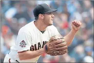  ?? KARL MONDON — STAFF PHOTOGRAPH­ER ?? Ty Blach pumps his fist after striking the Dodgers’ Yasmani Grandal with two men on in the sixth inning on Sunday. Blach allowed two runs in six innings.