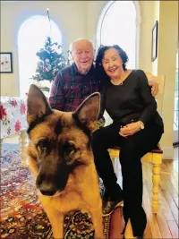  ?? Photo by Juri Love ?? Colin Browning and Maria Odler of Foxboro were reunited with Okaya, their 4-year-old German shepherd, on Christmas Eve after she was missing for four weeks. She was found 15 miles away in Pawtucket.