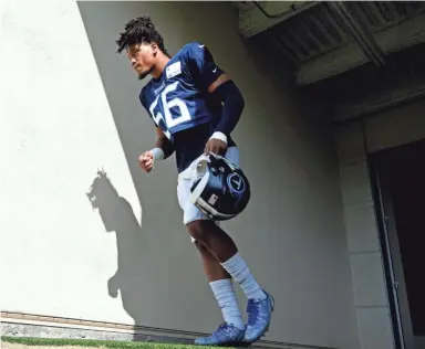  ??  ?? Titans outside linebacker Sharif Finch takes the field for practice in Nashville. GEORGE WALKER IV/TENNESSEAN.COM