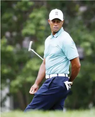  ??  ?? WHITE SULPHUR SPRINGS: Tiger Woods reacts to a missed birdie putt on the 14th green during the first round of the Greenbrier Classic golf tournament. —AP