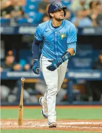  ?? MIKE CARLSON/AP ?? The Rays’ Rene Pinto watches his home run against the Giants during the sixth inning Sunday in St. Petersburg. It was Pinto’s second home run of the game.