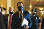  ?? MANUEL BALCE CENETA — THE ASSOCIATED PRESS ?? Treasury Secretary Steven Mnuchin walks from the office of Senate Majority Leader Sen. Mitch McConnell, R-Ky., as he leaves the Capitol in Washington on Wednesday.