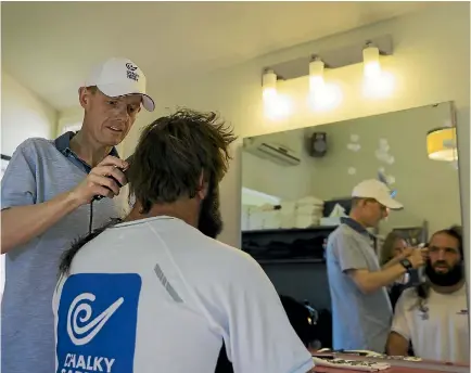  ?? PHOTO: ALDEN WILLIAMS/STUFF ?? Chalky Carr gets the clippers into Sam Whitelock’s hair.