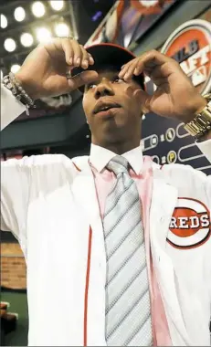  ?? Julio Cortez/Associated Press ?? Hunter Greene, a pitcher and shortstop from Notre Dame High School in Sherman Oaks, Calif., walks off the stage after being selected second by the Cincinnati Reds in the first round of the draft Monday night in Secaucus, N.J.