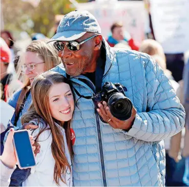  ?? [PHOTO BY NATE BILLINGS, THE OKLAHOMAN] ?? Carl Albert coach Tex Rollins hugs Carl Albert junior Cadley Schafer, 17, during a rally led by students on the third day of a walkout by Oklahoma teachers at the state Capitol in Oklahoma City on Wednesday.