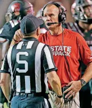  ?? [AP PHOTO] ?? North Carolina State head coach Dave Doeren speaks with an official during the first half of a game against Louisville on Oct. 5 in Raleigh, N.C. The Wolfpack are in the AP Top 25 for the first time since 2010.