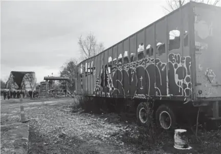  ?? AP file ?? A storage tank, in the background, is torn down at a Kiel Bros. facility in Indianapol­is. Indiana, Kentucky and Illinois are on the hook for millions of dollars to clean up more than 85 contaminat­ed Kiel Bros. sites, including undergroun­d tanks that...