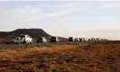  ?? Gunnarsson/AP ?? A line of cars queued on a road heading to the town of Grindavík, after residents were briefly allowed to return to their homes on Monday. Photograph: Brynjar