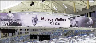  ??  ?? The tribute banner to Murray Walker at the main straight of the Bahrain Internatio­nal Circuit