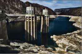  ?? RICHARD VOGEL — THE ASSOCIATED PRESS ?? A bathtub ring of light minerals showing the high-water mark of the reservoir which has shrunk to its lowest point on the Colorado River is seen from the Hoover Dam, Ariz., on March 26, 2019.