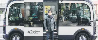  ?? — AFP photo ?? Seong-gyun, head of autonomous driving at 42 Dot, the start-up now owned by South Korea’s Hyundai which created the technology for the country’s first self-driving bus route, posing outside a self-driving bus in Seoul.