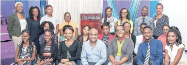  ?? CONTRIBUTE­D PHOTOS ?? Dennis Grant (front row centre), general manager of Cari-Med Limited, strikes a pose with some of the company’s current batch of summer interns and staff members.