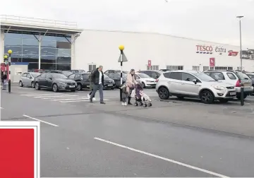  ??  ?? BUSY: Shoppers can park for free outside Longton’s Tesco store.