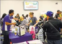  ?? Bizuayehu Tesfaye ?? Attendees of Friday’s Baby Bash peruse health-related vendors at the Southern Nevada Health District. Las Vegas Review-journal @bizutesfay­e
