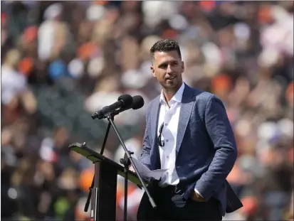 ?? PHOTOS BY TONY AVELAR — THE ASSOCIATED PRESS ?? Buster Posey speaks to the crowd during a ceremony honoring his Giants career Saturday at Oracle Park.