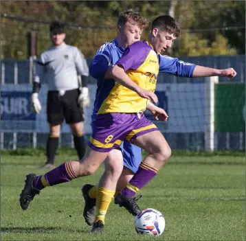  ??  ?? Cian Hanley of the Wexford Football League breaks away from Seán Leonard (Wicklow) in their Inter-Youth League opener in Ferrycarri­g Park on Saturday, won 7-1 by the home side.