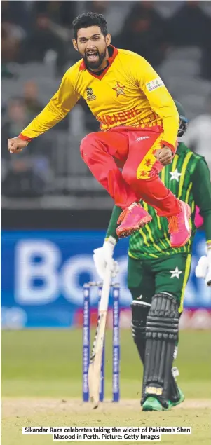  ?? ?? Sikandar Raza celebrates taking the wicket of Pakistan’s Shan Masood in Perth. Picture: Getty Images