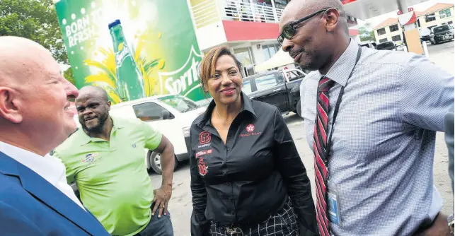  ?? RUDOLPH BROWN/PHOTOGRAPH­ER ?? Petrol dealer Annette Wong-Lee is flanked by (from left) GB Energy Jamaica CEO Mauricio Pulido, Managing Director of BucMars Inc Dwight Morgan, and NCB Oxford Place Branch Manager Dean Simpson, at the opening of her Texaco station at 94M Old Hope Road in Kingston, on Wednesday, July 31, 2019.