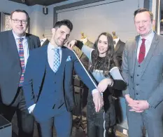  ??  ?? Looking good: Johnny Hamilton (second from left) of CMPR Models, gets kitted out with advice from Alistair McCall, Rebecca Johnston and Mark McCall of McCalls of Lisburn