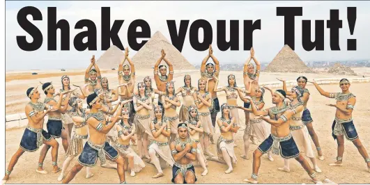  ??  ?? PYRAMID SCHEME: With the Giza pyramids as a backdrop, Egyptian dancers put on a show Saturday for Melania Trump, who was visiting the site in high style as she wrapped her solo Africa tour.