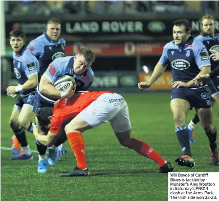  ??  ?? Will Boyde of Cardiff Blues is tackled by Munster’s Alex Wootton in Saturday’s PRO14 clash at the Arms Park. The Irish side won 33-23.