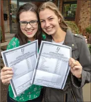  ?? Picture: John Delea ?? Kate Bradley and Eadaonn Vanderkrog­h both “through the Moon” as they recieve their Leaving Cert results from St Mary’s Secondary School, Macroom.