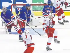  ?? AFP ?? Carolina’s Warren Foegele, No.13, celebrates after scoring against the Rangers.