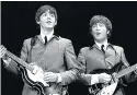  ?? MIKE MITCHELL/OMEGA AUCTIONS ?? Paul McCartney, left, and John Lennon