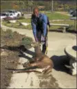  ?? NJSP TWITTER PHOTO ?? Trooper Dwayne Phillips is seen with a deer he rescued from a Harmony Township swimming pool.