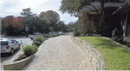  ??  ?? One driveway at a time, many homeowners and communitie­s are opting for permeable paving options instead of traditiona­l asphalt.