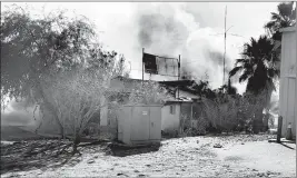  ?? LOANED PHOTO/SAN LUIS FIRE DEPARTMENT ?? SAN LUIS FIREFIGHTE­RS responded to a report of a commercial fire in an abandoned building at 718 East F Street behind the Family Dollar store on Wednesday afternoon. The fire destroyed the building and one person was arrested.